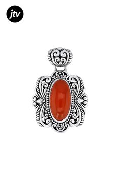 Experience the captivating beauty of our Artisan Collection of Bali��� with this exquisite 20x10mm Carnelian Sterling Silver Pendant. The stunning oval-shaped carnelian gemstone, measuring 20.00mm in length and 10.00mm in width, is elegantly set on a backdrop of lustrous sterling silver that has been meticulously crafted using an Oxidized Finishing Technique for added depth and character. This one-of-a-kind pendant boasts dimensions of 1.57 inches in length by 1.05 inches in width, making it a s Elegant Orange Agate Jewelry, Orange Oval Cabochon Jewelry For Formal Occasions, Classic Amber Oval Cabochon Jewelry, Elegant Red Cabochon Gemstones, Formal Orange Oval Cabochon Jewelry, Elegant Carnelian Natural Stone Jewelry, Traditional Carnelian Gemstone Jewelry, Elegant Carnelian Jewelry With Natural Stones, Orange Oval Beads Jewelry For Gift