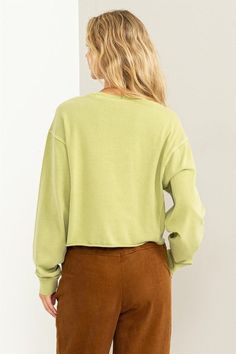 This cozy yet stylish sweatshirt is designed to make you feel lovely and comfortable at all times. The round neckline adds a classic touch, while the drop shoulders provide a relaxed and laid-back vibe. Embrace the cozy feel of the pair of long, loose sleeves that offer both comfort and a touch of chic. The banded cuffs add a subtle detail that complements the overall design. The slightly cropped and relaxed-fit bodice adds a modern twist to this timeless piece, allowing you to effortlessly show Relaxed French Terry Top For Fall, Relaxed Crew Neck Sweats For Fall, Relaxed Crew Sweater For Fall, Trendy Ribbed Neckline Sweatshirt For Loungewear, Relaxed Crew Neck Spring Sweatshirt, Casual French Terry Sweatshirt For Layering, Relaxed Crew Neck Sweatshirt For Spring, Trendy Crew Sweatshirt For Layering, Relaxed Leisure Top For Fall