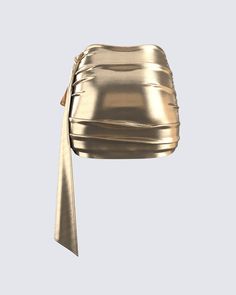 This golden drape skirt is your key to instant glam ✨ Made from lame jersey fabric, and complete with an asymmetrical hem, sash detail, ruching detail, and an elastic waistband - this skirt has a luminous allure perfect for stealing the spotlight anywhere you go 😌 Glamorous Gold Mini Skirt, Gold Mini Skirt For Evening, Gold Mini Skirt For Night Out, Chic Gold Mini Skirt For Party, Glamorous Gold Mini Skirt For Night Out, Chic Gold Skirt, Chic Gold Mini Skirt, Elegant Gold Mini Skirt For Spring, Asymmetrical Ruched Draped Skirt For Party