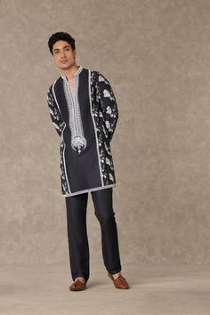 Elevate your style with this kurta adorned with contrast dori, sitara, and moti kaam around the neckline. The all-over digital printed sleeves, back, and side panel add a touch of sophistication. Enjoy the comfort of full sleeves with a contrast embroidered border, a mandarin collar, and convenient pocket details. Complete the look with straight pants featuring pocket detailing for a polished appearance. Kurta And Pants, Embroidered Border, Printed Sleeves, Full Sleeves, Straight Pants, Mandarin Collar, Pocket Detail, Panel Siding, Full Sleeve