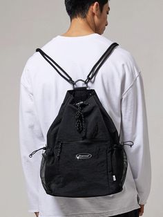 This is a casual and unique bag by BSMT that is made out of high quality and sturdy material. With distinctive mood of the design and comfortable wear, you can style it for your casual daily outfit.- Adjustable string and stopper on side and top- Miimal logo print detail- Casual and trendy mood Black Nylon Chest Bag With Large Capacity, Streetwear Nylon Backpack With Zipper Pocket, Modern Nylon Chest Bag For Outdoor Activities, Multifunctional Nylon Backpack For Streetwear, Black Nylon Chest Bag For Outdoor, Multifunctional Backpack For Streetwear, Streetwear Nylon Bags With Functional Pockets, Nylon Backpack Shoulder Bag For Streetwear, Black Backpack Shoulder Bag For Streetwear