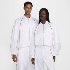 French designer Simon Porte Jacquemus and Nike team up to create and curate another collection. Clean, crisp and classic, this track jacket borrows some iconic design lines while bringing its own modern flair. The roomy sleeves and boxy cut keep the sporty look with a fresh, relaxed feel. It's fully equipped with water-repellent and wind-resistant crinkled nylon fabric to help you stay dry while cool mesh lining offers breathability. Sporty Look, Track Jackets, French Fashion, French Design, Active Wear For Women, Track, Water Repellent, Grey And White, Icon Design