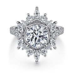 a diamond ring with an intricate halo setting