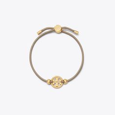 The Miller Slider Bracelet is inspired by retro friendship bracelets. Adjust the slider for the perfect fit. Slider Bracelet, Designer Bracelets, Tory Burch Miller, Designer Jewelry, Bracelet Designs, Alex And Ani Charm Bracelet, Sliders, Friendship Bracelets, Designer Shoes