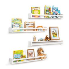 three white shelves filled with books and toys