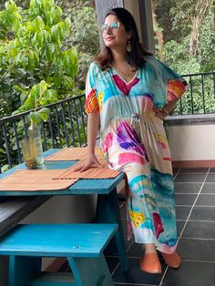 "This is our \"Timeless\" style kaftan. It features a drawstring that you can cinch at the waist. This loose fitting Caftan House dress is exceptionally comfortable and stylish. I created a short video about this style https://youtu.be/GDo-9c5XItk As for the fabric pattern, we have used a hand drawn and digitally painted technique. So they are all unique designs. It is like wearing wearable art. What I love about digital paintings is that they look as beautiful as the hand paintings but the care Vacation V-neck Kaftan With Tie Waist, Bohemian Flowy Maxi Dress With Drawstring, Casual Multicolor Maxi Dress With Elastic Waistband, Flowy Bohemian Maxi Dress With Drawstring, Casual Maxi Dress With Drawstring For Beach, Casual Beach Maxi Dress With Drawstring, Casual Drawstring Maxi Dress For The Beach, Multicolor Beach Dresses With Elastic Waistband, Multicolor Drawstring Dress For Vacation