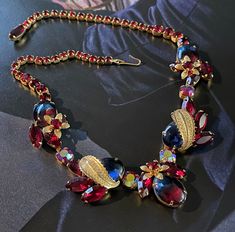 "The 1930s-1950s vintage Weiss Vintage Necklace, signed at the clasp. Stunning costume jewelry with beautifully designed rhinestones and blue red cabochon stones covered by golden leaves. Unique and hard to come by. This gorgeous necklace will definitely enhance the elegance and style to your look Measurements: 17\" Weight: 51g In great vintage condition as shown in pictures" Victorian Jewelry Necklace, 1800s Jewelry, Golden Leaves, Vintage Candles, Victorian Jewelry, Timeless Treasures, 1950s Vintage, Gorgeous Necklaces, Vintage Necklace