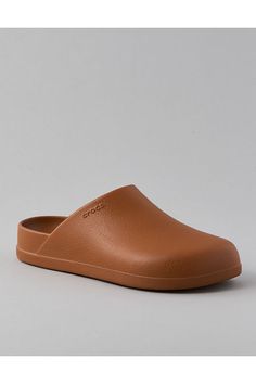 Subtle texture on upper mimics appearance of genuine, full-grain leather/Deep heel cup for extra comfort and improved fit/Single-piece molded Croslite™ for long-lasting durability/Iconic Crocs Comfort™: Lightweight. Flexible. 360-degree comfort. Modern Synthetic Clogs With Textured Sole, Modern Brown Slip-on Clogs, Brown Synthetic Clogs With Rubber Sole, Brown Synthetic Mules With Removable Insole, Classic Brown Mules For Everyday Wear, Classic Brown Mules For Everyday, Solid Synthetic Clogs With Rubber Sole, Solid Color Synthetic Clogs With Rubber Sole, Brown Synthetic Clogs With Cushioned Footbed