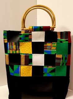 "Kente Cloth Bag | 100% Cotton and Vinyl Bag | Oversized Handbag | Boho Bag | Handcrafted Block Bag | Weekend Bag | Handmade | Gift When boho, traditional African fabric and vinyl meet, the combination is magical. These two textures have created this oversized handbag that is durable, reusable, and eye-catching. Along with the \"D-Shape\" handles and large inner pocket the bag is perfect for any occasion. Excited to introduce you all to my new \"Oversize Bag Collection. Handmade in a SMOKE-FREE Multicolor Rectangular Box Bag With Large Capacity, Everyday Multicolor Rectangular Box Bag, Multicolor Square Box Bag For Daily Use, Multicolor Rectangular Shoulder Bag With Removable Pouch, Green Square Bucket Bag With Handles, Multicolor Square Bucket Bag For Daily Use, Square Natural Bag With Removable Pouch, Everyday Multicolor Double Handle Box Bag, Green Rectangular Shoulder Bag With Leather Handles