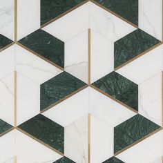 an abstract marble pattern with gold and green accents on it's sides, in shades of white and dark green