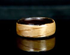 a wooden ring sitting on top of a table