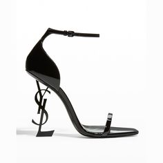 Saint Laurent shiny patent leather sandals. 4.3" blackened metal YSL heel. Elongated square open toe. d'Orsay silhouette. Adjustable ankle strap. Leather lining and sole. "Opyum" is made in Italy. Heals Aesthetics, Ysl Heels Black, Dream Heels, Ysl Aesthetic, Hak Tinggi, Fancy Heels, Ysl Sandals, Fly Shoes, Dr Shoes