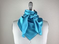 Beautiful handmade silk scarf. Pair this beauty with your favorite CR RanchWear shirt for a classy show look. 100% Imported Silk Size: 36x36 inches Made in Dallas, Texas Blue Satin Scarves, Blue Satin Silk Scarf As Gift, Blue Satin Silk Scarf For Gift, Elegant Blue Scarves For Party, Elegant Blue Scarves For Wedding, Elegant Blue Scarf For Wedding, Chic Blue Scarves For Gifts, Elegant Blue Silk Scarf For Wedding, Blue Silk Scarf For Wedding