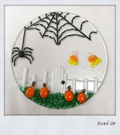 a glass plate with halloween decorations on it