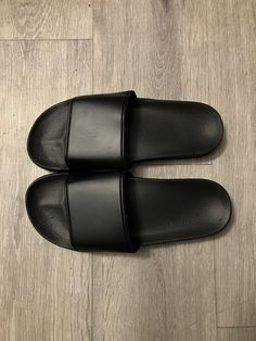 Plain black slides Men size 7-10 Casual Black Slide Flip Flops, Comfortable Black Slide Slippers, Comfortable Black Open Toe Slides, Casual Black Slip-resistant Slides, Black Open Toe Slippers For Streetwear, Comfortable Black Slides For Streetwear, Black Beach Slides, Black Cushioned Slide Slippers, Comfortable Black Slip-resistant Slides