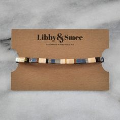 Like little works of art you can wear, these stretch tile bracelets — all in exclusive Libby & Smee patterns — are perfect on their own or in one of our curated sets. Stacking is strongly encouraged. style: GREY MIX glass and gold-plated tile beads stretch cords finished with gold-plated crimp covers lead-free and nickel-free comes in one 7" size to fit most wrists packaged in a clear resealing bag for storage and gift giving SAVE $15 when you buy a curated set or pick any three here: Libby Tile Bracelet, Works Of Art, Gift Giving, Bracelet Set, Mens Bracelet, Tile, Encouragement, Plating, Bracelet