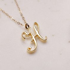 "H Initial Necklace - Cursive \"H\" initial gold pendant - Personalized initial gold pendant for women / Gift for her / for mom / for wife / Dainty \"H\" initial. Perfect every day necklace. Lovely gift for your self, sister, bridesmaids, new mom. Convo me if you would like to customize the length of the chain. The possibilities are endless. Pendant: Base metal is brass and 16K gold plated. Chain is 18 inches, 14k gold filled. (if you would like a longer or shorter chain, please contact us to cu H Cursive, Cursive H, H Initial Necklace, Every Day Necklace, H Initial, Gold Initial Pendant, Necklace Clasps, Initial Pendant Necklace, Pendant For Women