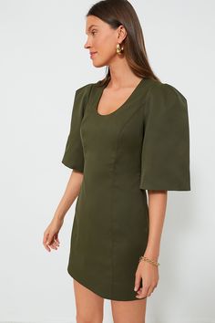 Perfect for drinks, dinners, and brunches alike, the Olive Twill Ariella Dress features an eye-catching silhouette in the color of the season. This fitted mini features half-length bell sleeves with double pleats at the shoulder for shape, and a U-scoop neckline that is perfect for displaying fun necklaces. Pair with heels, ballet flats, or sandals- this beauty goes with anything and everything! U-scoop neckline Half-length bell sleeves with puff shoulders Invisible side zip closure Princess sea Green One-shoulder Stretch Mini Dress, Spring Green Mini Dress With 3/4 Sleeves, Plus And Minus, Whale Tail, Cocktail Attire, Cool Necklaces, Office Fashion, Scoop Neckline, Green Dress