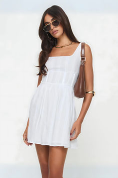 Elevate your style with the Lorinda White Mini Dress—a chic blend of sophistication and allure. Perfect for garden parties, summer soirées, and beach vacations. Features delicate lace detailing and a flattering silhouette. Embrace timeless beauty and make every moment unforgettable.#SummerStyle #ChicFashion #LaceLove #DressToImpress #ElegantAttire Square Neck Dresses With Ruched Bodice For Day Out, Square Neck Ruched Mini Dress For Day Out, Fitted Square Neck Sundress For Daywear, Fitted Sundress With Square Neck For Daywear, Elegant Sundress With Smocked Back And Square Neck, Fitted Sundress With Square Neck For Day Out, Cotton Sundress With Smocked Bodice And Square Neck, Chic Cotton Mini Dress With Square Neck, Cotton Summer Sundress With Square Neck