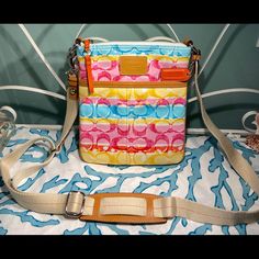 “Hamptons Weekend Collection” Great Crossbody For The Summer! New With Tags. Top Zip, Adjustable Strap, Outside Pocket On Both Sides. Summer Colors: Aqua, Pink And Yellow. Outside Slip Pocket On Front And Back. Great For Keys And Phone. Measures: 8 1/2”H X 7 1/4”W X1/2” D Item Is Being Sold “As Is”. See All Photos For Condition And Detail On Actual Pocketbook That You Will Receive. Check Back For More Spring/ Summer Bags To Be Listed. Designer Multicolor Bag With Adjustable Strap, Designer Multicolor Bags With Adjustable Strap, Designer Multicolor Shoulder Bag With Adjustable Strap, Coach Multicolor Bag With Detachable Strap, Multicolor Coach Pouch Bag, Multicolor Rectangular Coach Shoulder Bag, Coach Multicolor Shoulder Bag, Multicolor Coach Bag With Zipper Closure, Coach Multicolor Rectangular Bag