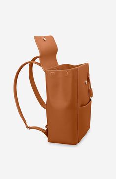 A chic and ultra-spacious office companion to refine your work-from-anywhere style. The Large Soft Backpack, handcrafted entirely from full-grain European leather, reimagines The Mini Soft Backpack with enhanced storage capability and increased all-day comfort. Featuring magnetic closure, a padded laptop sleeve to secure devices up to 16" and priority and zipped pockets to house valuables, the elegant carryall caters to every professional need. Crafted entirely from full grain sustainable DriTan Luxury Leather Satchel Backpack For Work, Chic Leather Backpack For Business, Classic Satchel Backpack For Work, Office Leather Backpack With Adjustable Strap, Chic Brown Leather Travel Backpack, Classic Workwear Satchel Backpack, Modern Rectangular Leather Backpack For Work, Modern Leather Satchel Backpack For Work, Classic Leather Backpack For Work