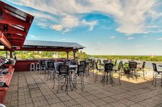 an outdoor dining area with tables and chairs