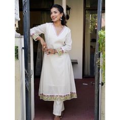 White pure cotton kurta set with hand embroidery details. Size Chart THESE ARE GARMENT MEASUREMENTS (IN INCHES)  XSSMLXLXXL Chest343638404244 Waist303335373941 Hip363840424446 Shoulder13.51414.51515.515.5 Kurta Length484848484848 Pants Length393939393939 Embrace your mesmerizing look with this crafted White Embroidered Cotton Anarkali Kurta with Pants Set. The White Cotton Anarkali kurta has embroidery, a round neckline and 3/4th sleeves. The White cotton pants have embroidery and both of them have an attached lining. COLOUR: White MATERIALS: Cotton CARE: Dry Clean Only We accept PayPal for payment, a safest way for both of us.  Thank you! Hakoba Kurta Designs, Salwar Kurta Designs, White Cotton Anarkali, Satin Kurta, White Cotton Pants, Cotton Anarkali Kurta, Best Designer Suits, Cotton Kurta Set, Cotton Anarkali