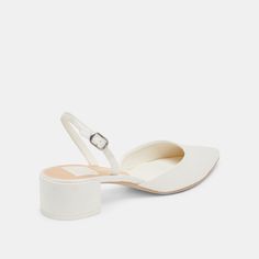 Say yes to simple, with CAREL. Minimalist yet regal, this slingback mule features a low to the ground block heel, a pointed toe, and comes in a dreamy white satin. Crafted from recycled materials, CAREL is perfect for your next event. Textile Upper Recycled Synthetic Outsole Water-based Leather Alternative Lining + Sock 1.8" Heel Height Imported Low Wedding Shoes Brides, 2025 Heels Trends, Low Heel Bride Shoes, White Satin Kitten Heels, Low Block Wedding Heels, Wedding Shoes Bride Small Heel, White Satin Wedding Shoes, Closed Toe Bridal Shoes, Short Heel Wedding Shoes