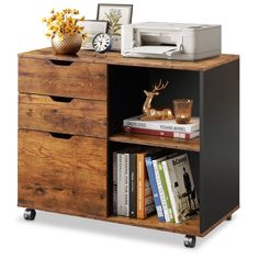 a desk with two drawers and a printer on top of it next to a book shelf