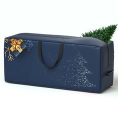 a blue bag with a christmas tree on the front and snowflakes on the back