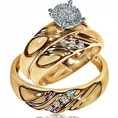 two gold wedding rings with diamonds on top