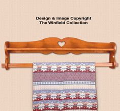 an image of a towel hanging on a wooden rack with the words design & image copyright the whimfield collection