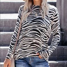 Nwot. Round Neck, Zebra Stripe Print, Long Sleeves. Cuffed At End Of Sleeves And Bottom Of Blouse. Zippered Sides, Except Zippers Are White Instead Of Silver As Pictured In Stock Photos. Back Is Slightly Longer Than The Front. Poly Blend. Bust: 39.4”. Length 26.5”. Sleeves 20.5”. Casual Long Sleeve Zebra Print Tops, Casual Zebra Print Tops For Spring, Trendy Long Sleeve Tops With Zebra Print, Trendy Long Sleeve Zebra Print Tops, White Long Sleeve Top With Zebra Print, Trendy Zebra Print Tops For Spring, Casual Stretch Zebra Print Top, Spring Zebra Print Tops, Spring Zebra Print Stretch Top