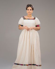 This elegant dress blends tradition with modern flair, making it a standout piece for cultural and formal events. It is adorned with narrow handmade Tilef around the neckline, sleeves and hemline, giving it a sophisticated traditional look. Material Cotton Thread Estimated delivery : 1week to 2weeks Contact WhatsApp +1(304)-306-2784Email: contact@ethiopian.store Ethiopian Dress, Dresses Chiffon, Wedding Dress Chiffon, Caicos Islands, Wedding Dresses Simple, Pitcairn Islands, Elegant Dress, Bosnia And Herzegovina, Formal Event