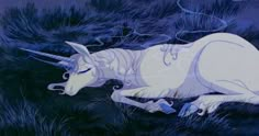 an animated unicorn laying on the ground