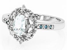 0.60ct Oval Aquamarine, 0.04ctw Round White Zircon With 0.05ctw Round Blue Diamond Accent Rhodium Over Sterling Silver Ring. Measures Approximately 0.52"L x 0.45"W. Not sizeable. Accent stones primarily zircon. White Oval Topaz Ring With Prong Setting, White Oval Topaz Ring With Brilliant Cut, Oval White Topaz Ring With Diamond, White Oval Topaz Ring With Center Stone, Aquamarine Blue, Blue Diamond, Aquamarine, Sterling Silver Ring, Sterling Silver Rings