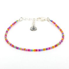 Dainty bracelet - multi color stained glass beads - creations by cherie Adjustable Multicolor Beaded Sterling Silver Bracelets, Adjustable Multicolor Sterling Silver Beaded Bracelets, Adjustable Sterling Silver Beaded Bracelets With Colorful Beads, Multicolor Beaded Sterling Silver Bracelets, Multicolor Sterling Silver Beaded Bracelets, Sterling Silver Multicolor Beaded Bracelets, Adjustable Multicolor Tiny Beads Jewelry, Adjustable Czech Glass Bracelets With Tiny Beads, Silver Bracelet With Tiny Beads For Festivals