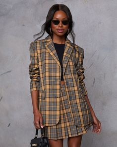 Meet your new fall favorite: the Siena Plaid Blazer. Crafted from sleek suiting fabric, this blazer features a polished front button closure and a chic collar for an effortlessly sophisticated look. Perfectly tailored for a flattering fit, it’s an ideal match for the pleated mini skirt (sold separately) for a coordinated ensemble that transitions seamlessly from day to night. Runs large, consider sizing down Suiting fabric Front button closure Buttoned cuffs Lined Shell: 68% Polyester 32% Rayon Fitted Button-up Blazer Dress For Business Casual, Trendy Fitted Double-breasted Blazer, Trendy Fitted Blazer With Double Button, Trendy Fitted Blazer With Double Button Closure, Fitted Trendy Blazer With Double Button Closure, Trendy Fitted Button-up Blazer, Business Casual Blazer With Suit Collar, Office Chic Business Casual Blazer With Suit Collar, Chic Button-up Blazer With Welt Pockets