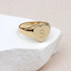 PRODUCT DESCRIPTION * This beautiful personalised 9ct yellow gold plain heart signet ring is crafted from solid gold. Personalise it by engraving your initial or those of a special someone to create a unique keepsake. * The delicate heart design adds a touch of love to your everyday style. Whether it's a self-indulgent treat or a thoughtful gift, this 9ct gold heart signet ring complements any occasion. ONE YEAR WARRANTY- We offer a one-year guarantee on all our products. FREE GIFT BOX- All our Personalised Baby Bracelet, Heart Signet Ring, Mens Bracelet Personalized, Engraved Handwriting, Girls Personalized Gifts, Gold Starburst, Boys Jewelry, Baby Bracelet, Month Gifts