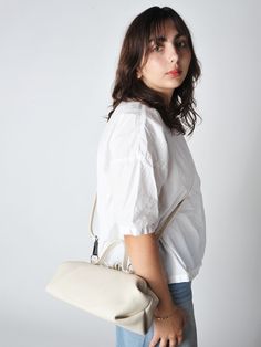 The baguette bag is a charming framed ladies bag. softly structured in a supple leather and lightweight it has a snap top closure and a detachable adjustable strap which allows for multiple carry options.    • handmade in utrecht the netherlands  • 14"l x 6"h x 5"d - unlined  • detachable adjustable shoulder strap 38" - smoke hardware  • 3.5" handles  • single snap top frame closure.  2 small drop down pockets on either side of the bag  • exclusive to roztayger in the us Everyday Rectangular Hobo Bag With Detachable Strap, On-the-go Satchel Baguette Bag With Adjustable Strap, On-the-go Baguette Satchel Bag With Adjustable Strap, Modern Shoulder Bag With Rolled Handles For On-the-go, Timeless Baguette Bag With Detachable Handle For Daily Use, Timeless Everyday Flap Bag With Double Handle, Timeless Hobo Bag With Detachable Strap For Daily Use, Timeless Everyday Top Handle Flap Bag, Timeless Double Handle Flap Bag For Everyday