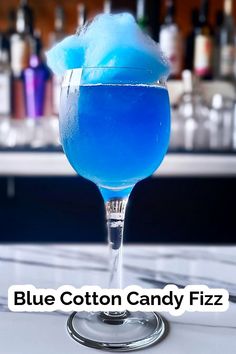 a blue cotton candy fizz sitting on top of a table