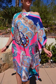 Stunning silk tunic to brighten up your wardrobe.  Dressy or casual, you will feel special in this beautiful multi print silk dress.   One size.  Fits small to large sizes.  The width is 39 inches, 78 inches around, and the side seams are 5 inches from the edge.  The length is 39 inches.  Hand wash. Print Silk Dress, Silk Tunic, Silk Print Dress, Womens Kimono, Print Kimonos, Women Shawl, Silk Wrap, Silk Kimono, Feel Special