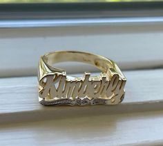 Medium Size Personalized Name Ring In Real 10K & 14K Gold *FLAT FACE * MADE IN USA (HAND MADE ITEM) Make the names of your family, friends and love ones into rings for their gift. It's great as an everyday necklace and makes an awesome gift! This Item is 100% customization especially for you. Item Description *Material: Real Gold *Type: *FLAT FACE* ( Like photo) with Heart Tail with Bit Work *Ring size: ring sizes between 1-11 (including half sizes) *Size of Ring : 20mm*8mm *Script Design *O Yellow Gold Engraved Promise Ring With Name, 14k Gold Promise Ring With Names, Yellow Gold Promise Ring With Engraving, 14k Gold Engraved Ring For Promise With Names, Custom Name Engraved Yellow Gold Promise Ring, Gold Nameplate Engraved Ring For Anniversary, Gold Engraved Nameplate Ring For Anniversary, Yellow Gold Engraved Ring With Names For Promise, 14k Yellow Gold Engraved Ring With Names