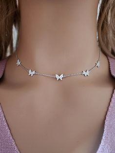 925 Sterling Silver Cubic Zirconia Butterfly Choker Necklace Real 925 Sterling Silver NOT SILVER PLATED High Quality Silver Pendant  High polished rhodium finish gives this pendant a stunning shiny look that lasts many years. We have hundreds Silver Jewelry in stock. If you don't see what you are looking , feel free to ask us. Trendy, dainty, luxurious, classic with modern touch, elegant and fancy, fine quality made  925 Sterling Silver cubic zirconia butterfly choker necklace. Descriptions 925 Sterling Silver Cubic Zirconia Choker Necklace Metal Type: 925 Sterling Silver ( Not Plated) Width & Length: 6.5mmx7.5mm.  Setting Type: Pave Set  Finishing : High Polish Rhodium Plate Pendant Length: 15 - 14 - 13 Inches Adjustable Shipping : 1 - 2 Days Can be personalized: Yes Free shipping With $3 Silver Cubic Zirconia Charm Necklaces For Jewelry Making, White Sterling Silver Butterfly Necklace With Clavicle Chain, Silver Stainless Steel Butterfly Necklace As Gift, Silver Stainless Steel Butterfly Necklace Gift, Silver Butterfly Pendant Necklace In Cubic Zirconia, Silver Butterfly Pendant Necklace With Cubic Zirconia, Silver Charm Necklaces In Fine Jewelry Style, Silver Sterling Butterfly Necklace With Clavicle Chain, Silver Cubic Zirconia Butterfly Pendant Necklace