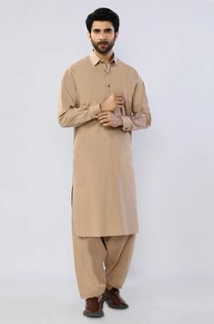 Mens Beige Plain Shalwar Kameez Mens Eid Shalwar Kameez Color: Beige Fabric: Cotton Dress Type: Handmade Please beware when you're choosing the variations of this dress. Feel free to discuss any issue regarding your order. You'll get a quick solution and will be satisfied. Cotton Traditional Wear With Naqshi For Eid, Semi-formal Long Sleeve Traditional Wear For Eid, Festive Semi-formal Cotton Traditional Wear, Formal Beige Unstitched Lawn Suit, Traditional Chikankari Embroidered Kurta For Semi-formal Occasions, Semi-formal Long Sleeve Kurta With Dabka, Semi-formal Long Sleeve Unstitched Salwar Kameez, Semi-formal Long Sleeve Kurta For Eid, Semi-formal Long Sleeve Dabka Kurta