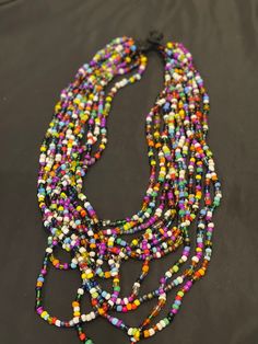 African Maasai beaded necklace for women. Handcrafted and produced by local communities in Tanzania, Africa. Theses pieces of Jewelery are carefully selected from local Vendors based in Tanzania, Africa. Karibu sana! Artisan Colorful Beads Necklaces For Festivals, Artisan Necklace With Colorful Beads For Festivals, Polished Beads Long Necklace For Festival, Artisan Long Beaded Necklace With Colorful Beads, Multicolor Polished Beads For Jewelry Making, Long Polished Beads Necklace For Festival, Festival Long Beaded Necklaces, Multicolor Beaded Necklaces For Crafting, Long Beaded Necklace For Festivals