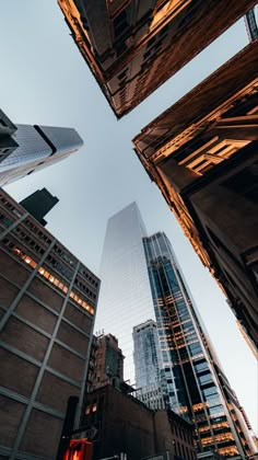 looking up at tall buildings in the city