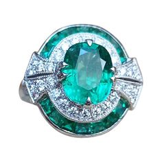 Emerald 2.44 carats, Emerald 1.15 carats with Diamond 0.64 carat Ring set in 18 Karat White Gold Settings Width: 1.8 cm Length: 1.8 cm Ring Size: 50 "Since we first opened doors in 1980 our store was then situated in the vicinity of the Victory Monument; a small and modest storefront with a couple of counters. From our humble beginnings to where we stand today, we has proven our abilities as a jeweler. From the 80s up til today, we have been supplying fine quality pieces to dealers, wholesalers and customers worldwide. Our company still interrelates its name with quality products and excellent service, where commitment and sincerity toward our customers will always be our motto." Classic Platinum Gemstones Gia Certified, Classic Gia Certified Platinum Gemstones, Gia Certified Platinum Classic Gemstones, Gia Certified Oval Emerald Ring In Art Deco Style, Platinum Emerald Ring In White Gold, Luxury Platinum Emerald Ring With Diamond Cut, Art Deco Oval Emerald Ring With Brilliant Cut, Platinum Oval Emerald Ring With 17 Jewels, Oval Platinum Emerald Ring With 17 Jewels