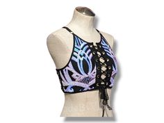 This crop top, featuring a lace-up backless design, is ideal for raves, festivals, and nightlife. Made of a sequin mesh fabric, it is lined with supportive polyester. Supportive and adjustable for a perfect fit every time. Summer Festival Crop Top With Sequins, Sleeveless Rave Crop Top For Festival, Gothic Tops For Summer Festivals, Rave Festival Stretch Crop Top, Disco Stretch Crop Top For Festival, Rave Style Stretch Crop Top For Festival, Disco Style Stretch Crop Top For Festival, Beach Fitted Sequined Crop Top, Beach Sequin Fitted Crop Top