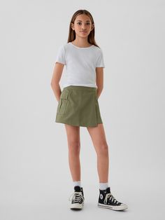 Smooth woven cotton-Tencel blend skort.  E-waist at back, concealed hook and bar closure at front.  Cargo pocket.  Inner shorts, wrap-style front.  Classic, easy fit.  Hits above the knee. Girls Skorts, Uniqlo Kids, Skort Outfit, Olive Shorts, Wrap Skort, Fitness Wear Outfits, 2024 Outfits, Support People, Gender Equality